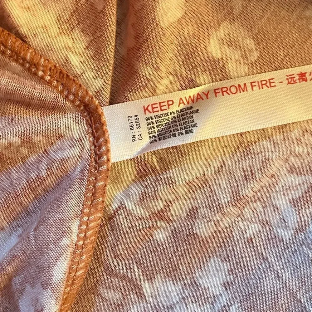 NWT-FREE PEOPLE Turnt Bodysuit